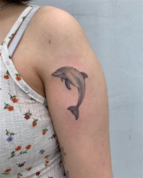 Celebrating the Ocean's Beauty: A Tribute to Dolphin Tattoos