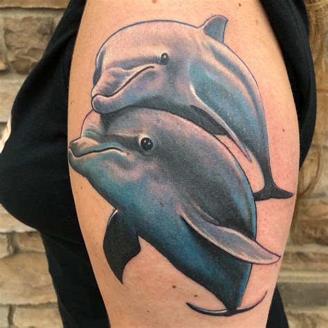 Dolphin Tattoos for Men: Conveying Strength, Power, and Wisdom