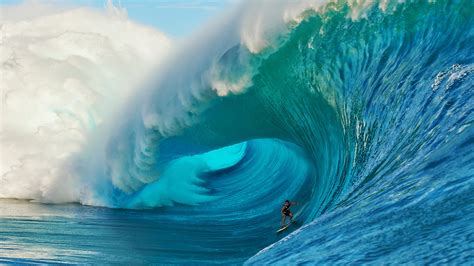 Exploring the Danger and Beauty of Surfing Massive Waves